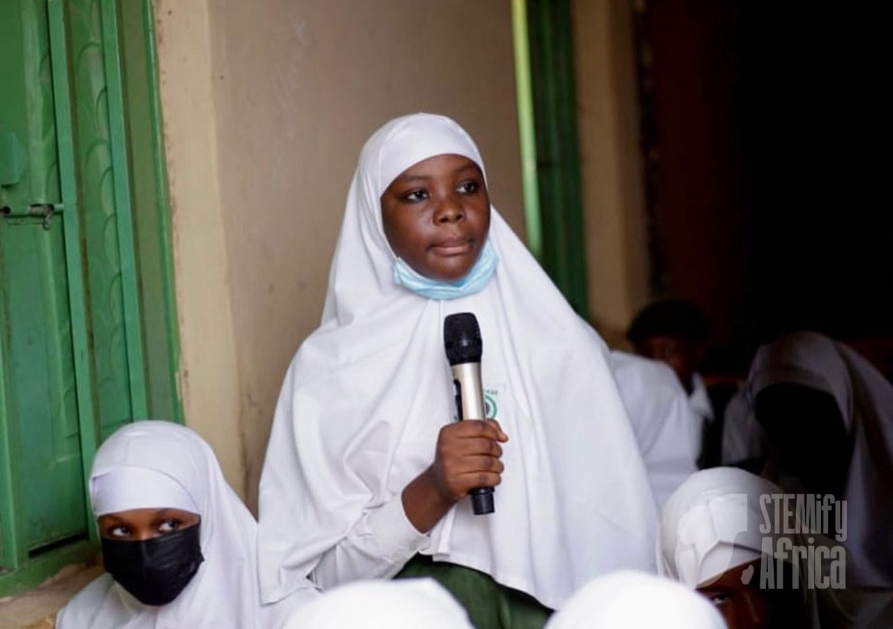 Student speaking with microphone