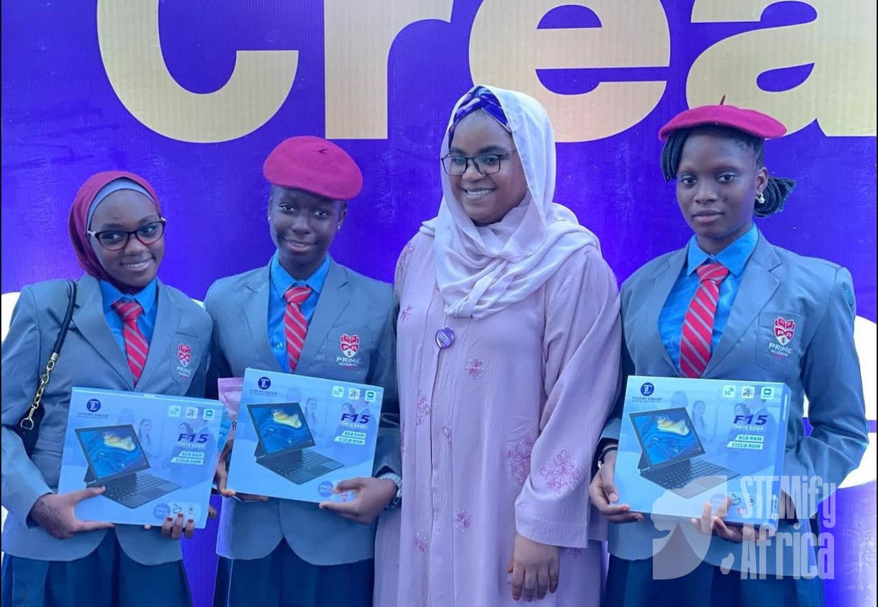 Students receiving laptops at award ceremony